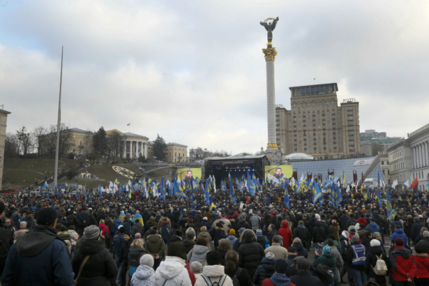 Activists attend a rally in central Kyiv, Ukraine, Sunday, Dec. 8, 2019. Several thousand people rallied Sunday in the Ukrainian capital of Kyiv to demand that the president defend the country