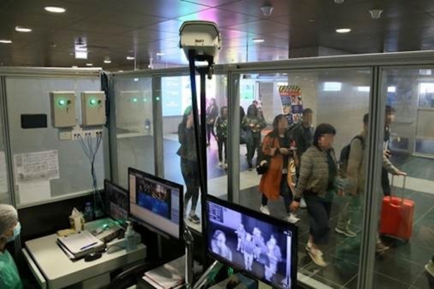 Officials monitor thermal scanners