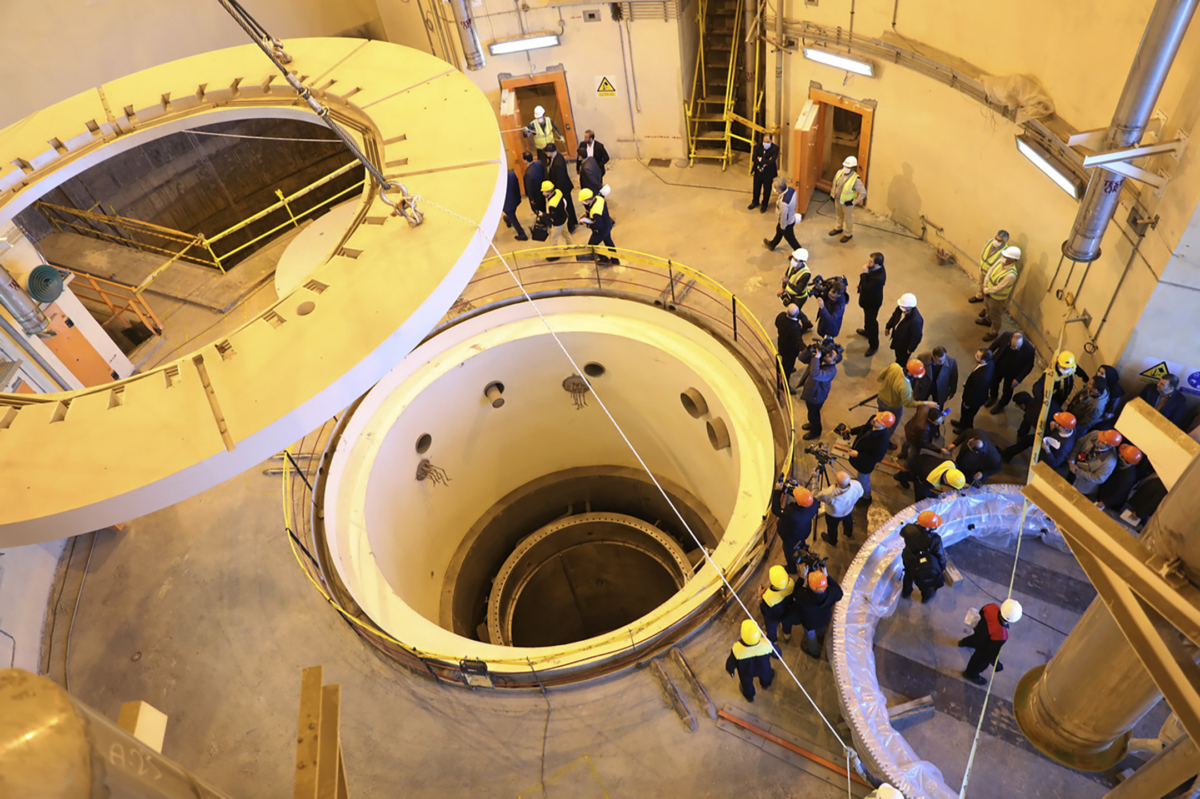 In this photo released by the Atomic Energy Organization of Iran, technicians work at the Arak heavy water reactor