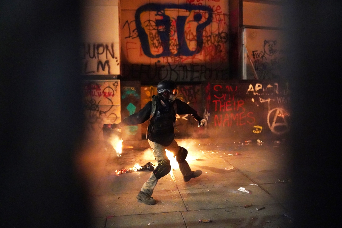 rioter-throws-trash