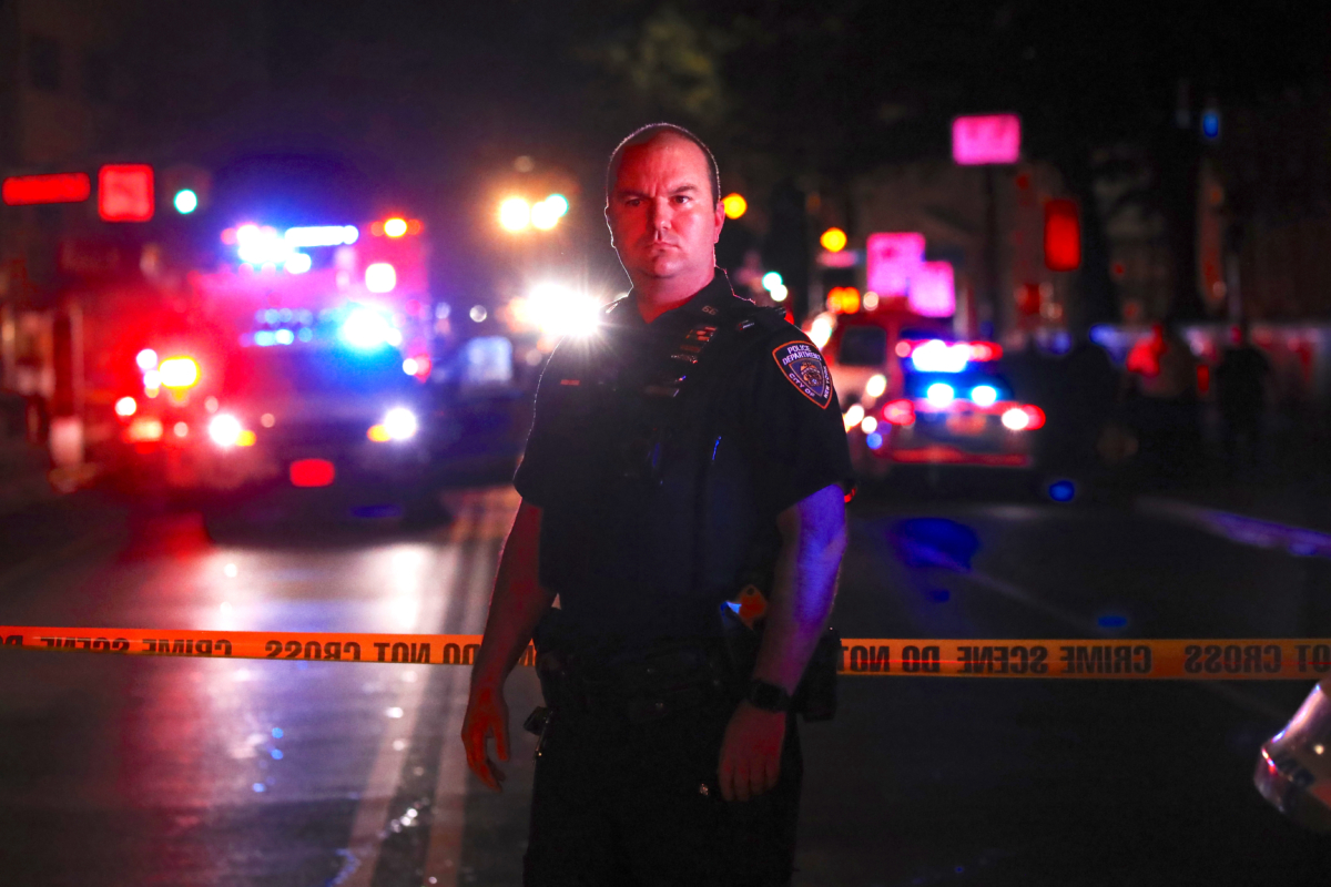 Police gather at the scene
