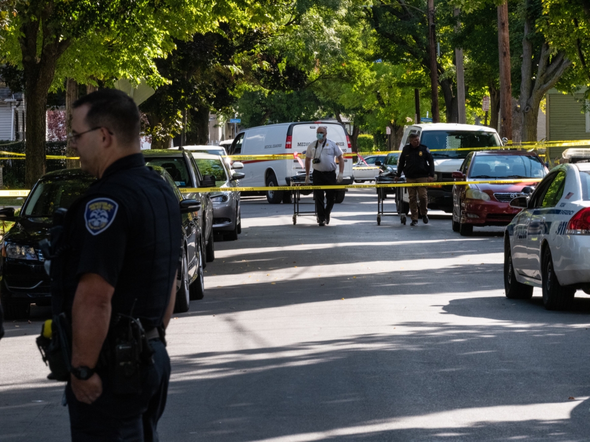 Police officers investigate the crime scene