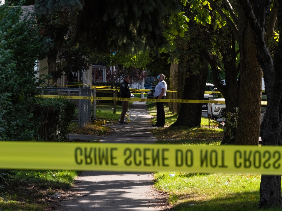 Police officers investigate the crime scene