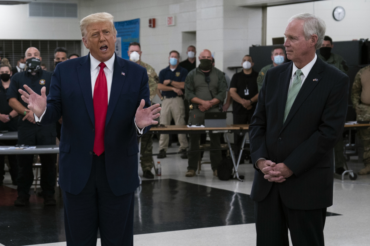 President Donald Trump speaks as Sen. Ron Johnson