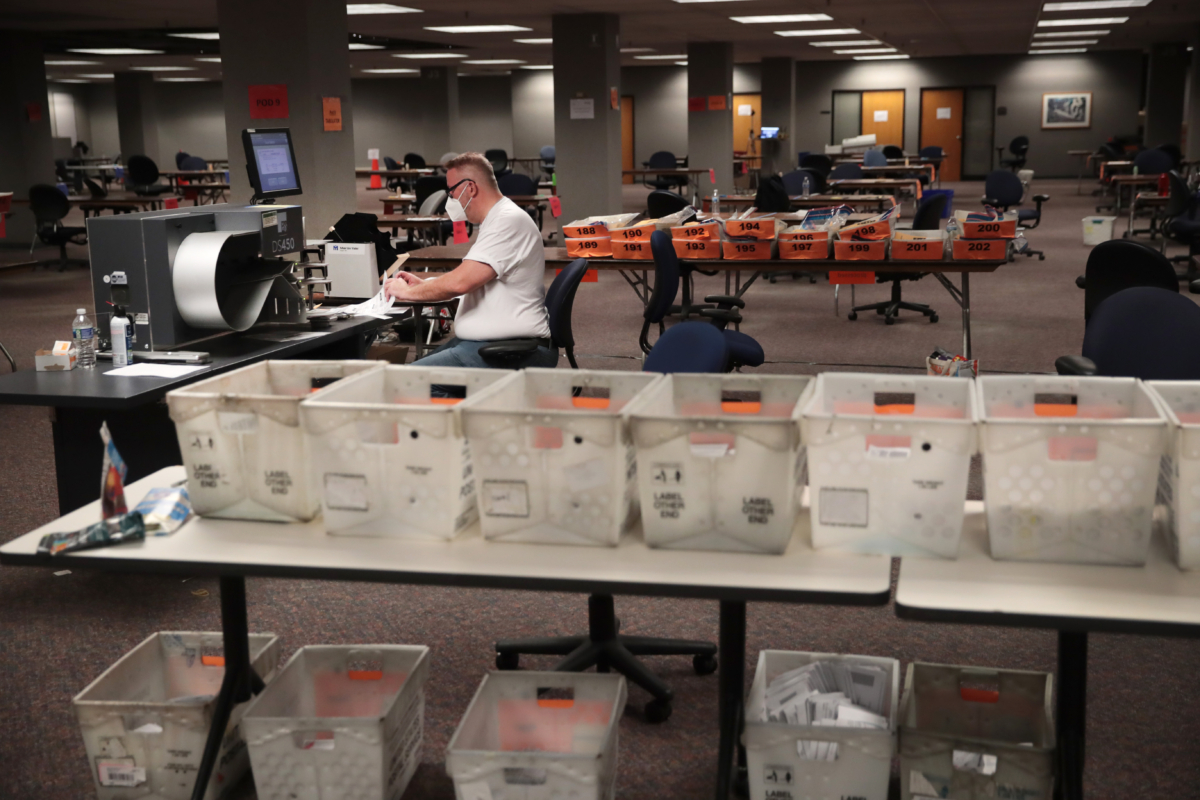 Election officials count absentee ballots