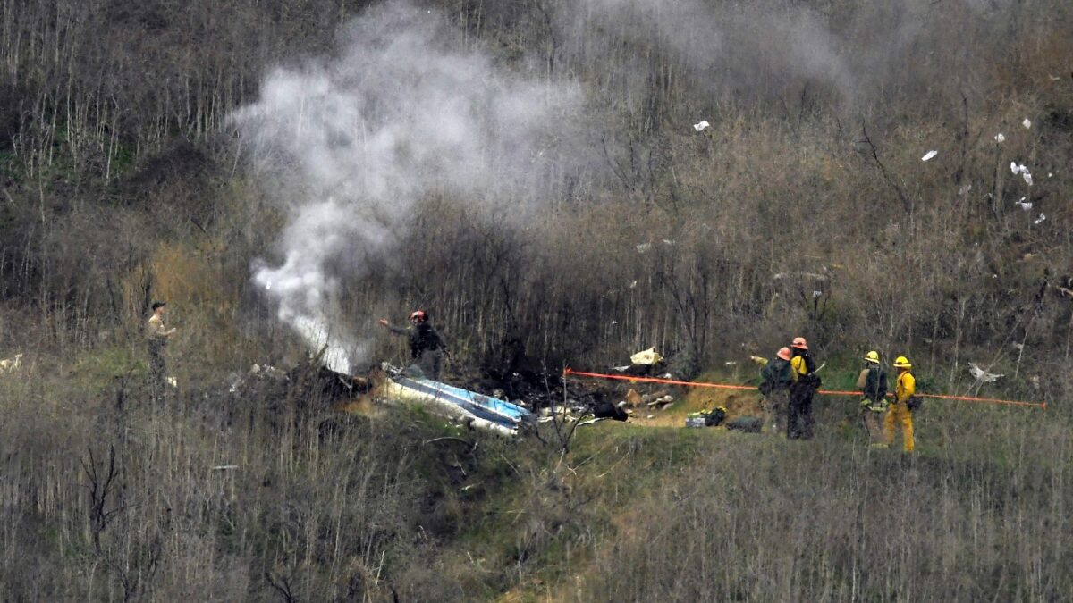 Firefighters work the crash scene