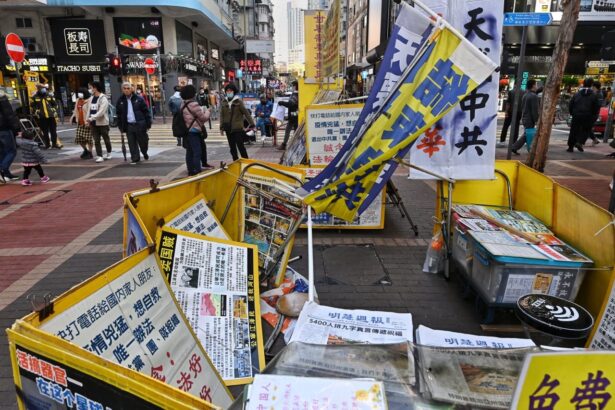A Falun Gong information booth is vandalized