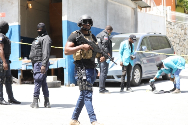 Members of the Haitian police and forensics