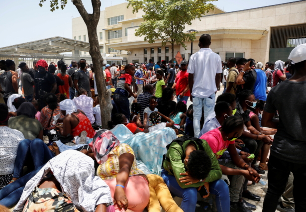 Haitians gather outside the U.S. Embassy