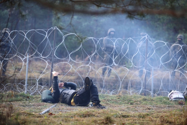 A migrant on the ground-Belarusian-Polish border
